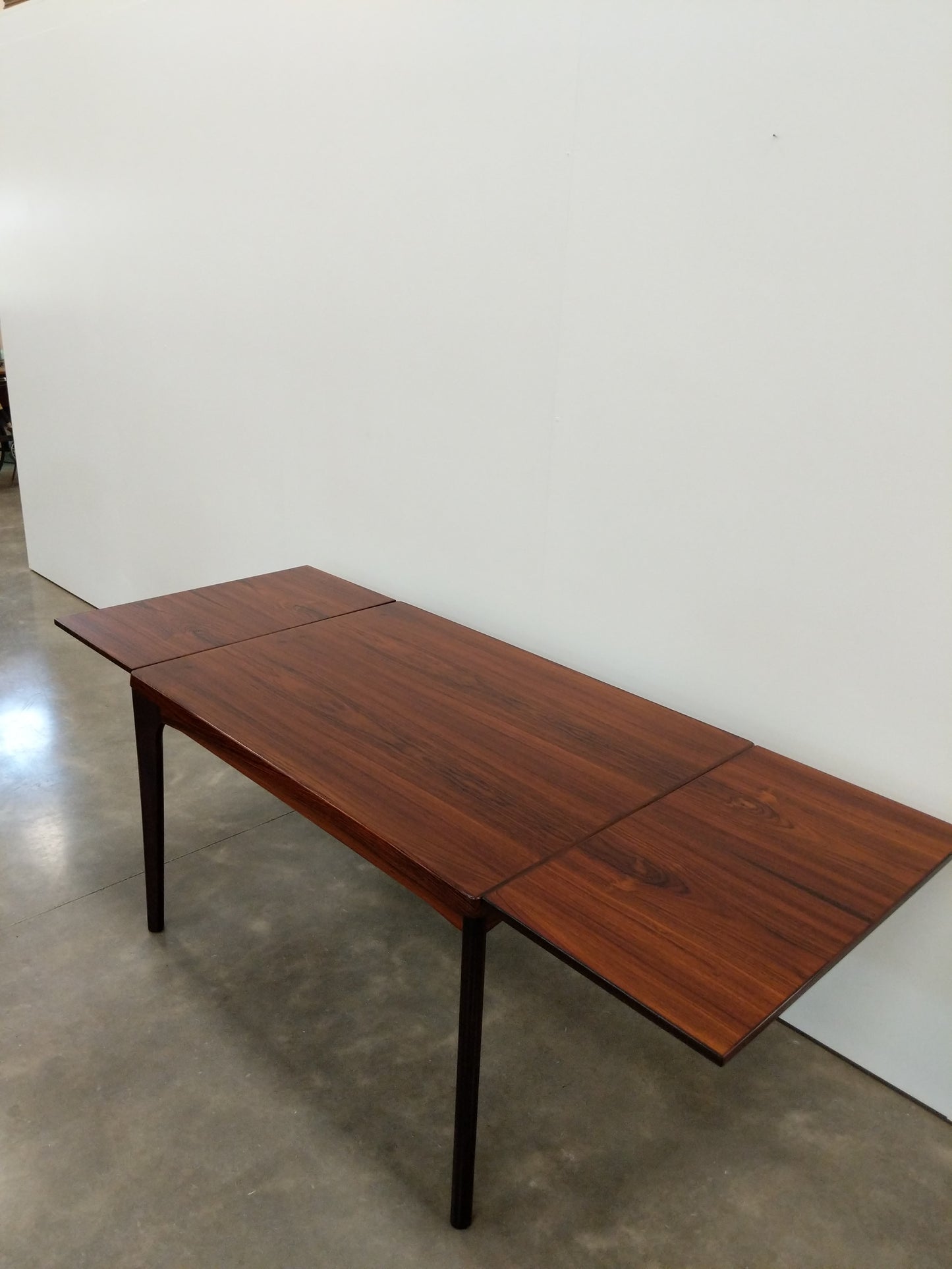 Vintage Danish Modern Rosewood Extendable Dining Table by Henning Kjaernulf
